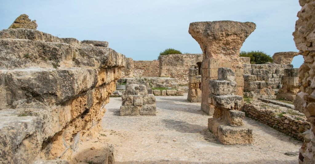 Famous remains of old historic stones with ruined columns located on street against cloudless sky located in Tunisia in Turkey